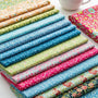 Colorful premium designer cotton fabrics showcasing intricate patterns and textures for quilting