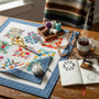 Colorful quilt and sewing tools in a cozy workspace